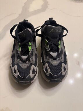 Nike Kids Black and Gray Athletic Sneakers with Green Accent